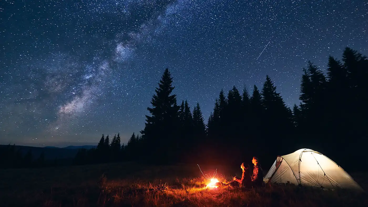 Lake at night with open Campfire